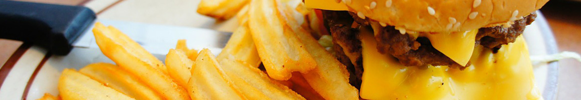 Eating American (Traditional) Burger at Islands Restaurant Long Beach Pike restaurant in Long Beach, CA.